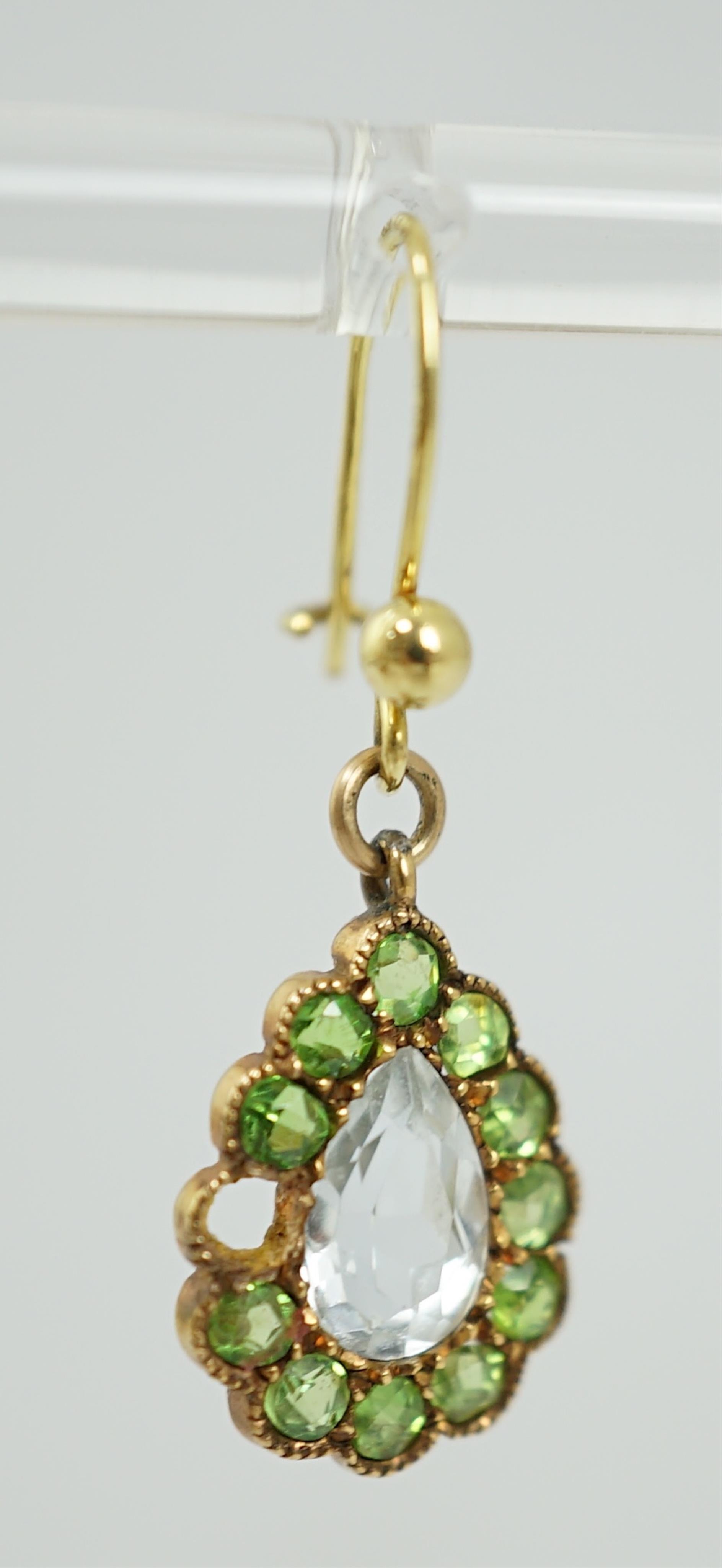 A pair of late Victorian yellow metal, aquamarine and demantoid garnet cluster set pear shaped drop earrings